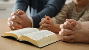 Parents and child with open bible